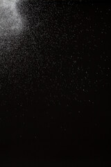 White splashing water on black background