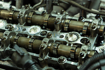 Fototapeta na wymiar Car engine camshafts disassembled for maintenance 6