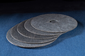 Fototapeta na wymiar Cutting disc for a grinder on a blue table