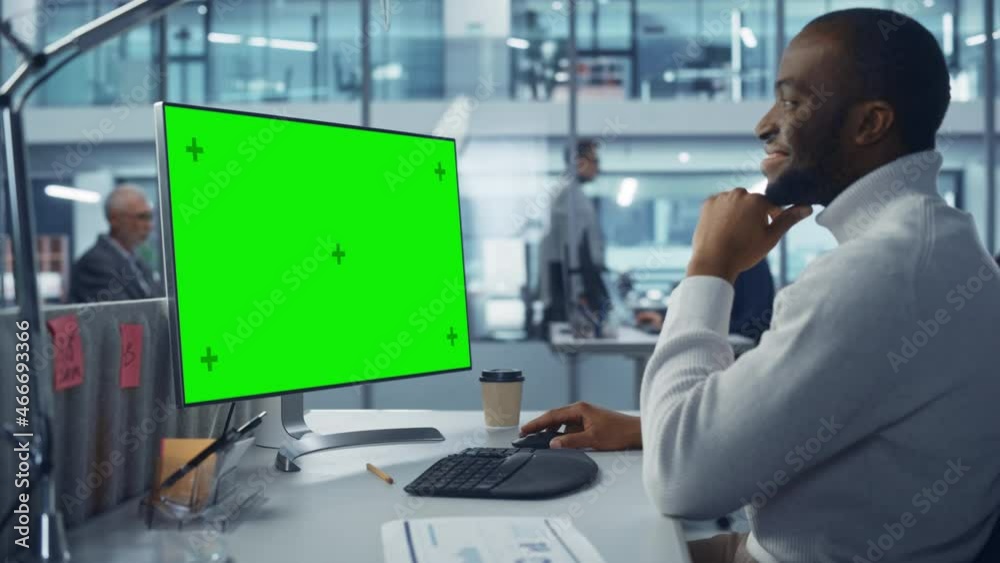 Poster Diverse Modern Office: Handsome Black IT Technician Using Desktop Computer with Green Chroma Key Screen. Engineer Administrator Work on e-Commerce Development, Project Marketing, Big Data Analysis
