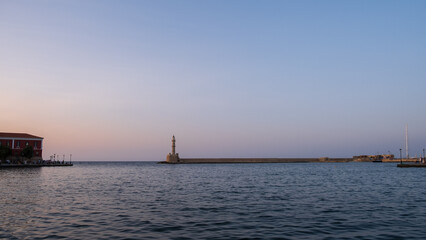 Lighthouse of Chania in the sunset above the Mediterranean sea