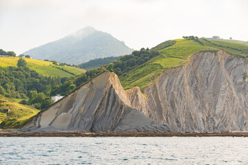 The Zumaia flysch as seen from the Cantabrian sea in the Basque Coast Geopark. Taken in the Basque Country, Spain, in July 2021