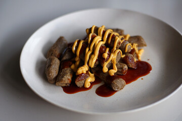  Keropok Lekor or fish sausage made up from fish and sago flour and seasoned with salt and sugar.