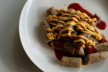  Keropok Lekor or fish sausage made up from fish and sago flour and seasoned with salt and sugar.
