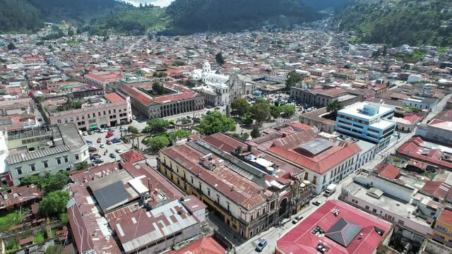 Parque Centro America Centro Historico Quetzaltenango, Xela, Guatemala. Drone footage of Central Park in urban colonial highlands Guatemalan city surrounded by neighborhoods and old buildings.