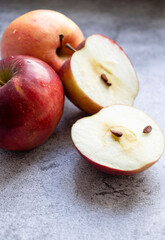Red apples on a gray background. healthy eating