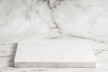 White artificial stone block for cooking and serving the dish on marble background