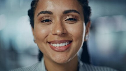 Portrait of Gorgeous Black Woman with Deep Brown Eyes, Braided Hair, Perfect Smile. Beautiful Girl Turns, Looks at the Camera with Kind Dreamy Gaze. Bokeh out of Focus Background. Close-up Slow Motion - Powered by Adobe