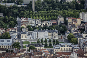Fototapeta na wymiar Picturesque Grenoble city panorama from La Bastille Hill. Grenoble, Auvergne-Rhone-Alpes region, France.