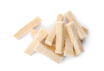 Heap of crispy rusks on white background, top view