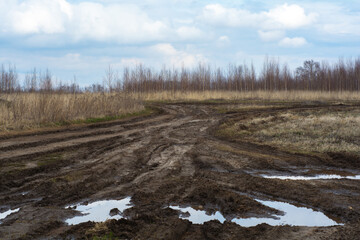 Bad country road. A dirt road damaged. Clay, dirt. Concept problem with the roads. human impact on the environment. Russian bad road