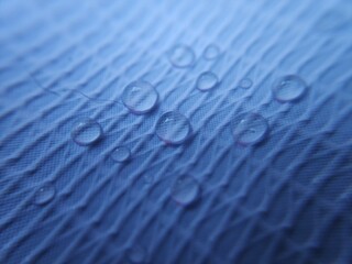 Water drop on fabric textured surface