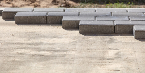 Laying paving slabs at a construction site.