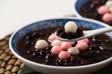 Red and white tangyuan with red bean soup.