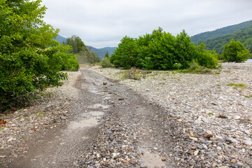 Fototapeta premium Dirt road in a mountainous area