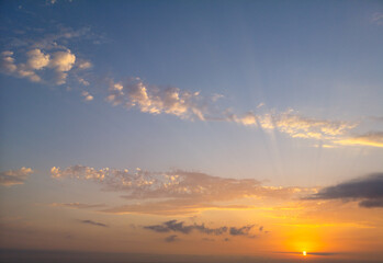 Colorful sunset in the sky with clouds.