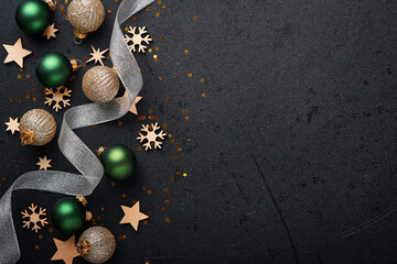 Christmas golden, green and silver balls baubles dark black background. Christmas Decoration....