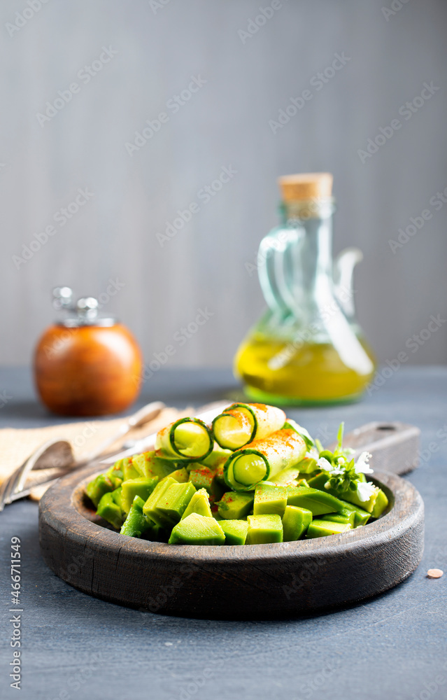 Canvas Prints Salad with , avocado, cucumber and nuts on plate, top view