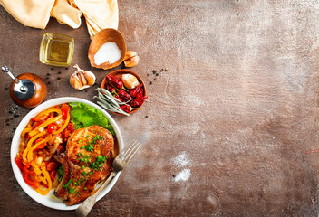 grilled sliced steak and spice on table, top view