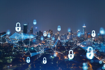 Glowing Padlock hologram, night panoramic city view of Bangkok, Southeast Asia. The concept of cyber security to protect companies. Double exposure.