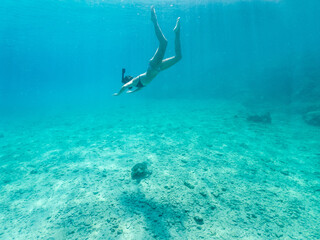 Woman snorkeling with the turtle. Underwater world
