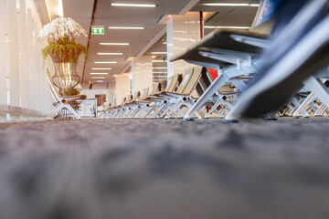 Empty seats for traveler waiting rest inside departure lounge at Phuket international airport, Trip transport seat in airport covid-19 situation, Depression of the COVID Epidemic. No people travel
