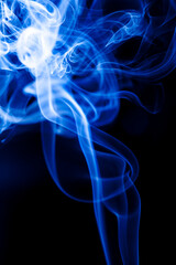 Obraz premium Motion blue smoke on black background.