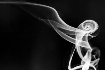 White  smoke motion on black background.