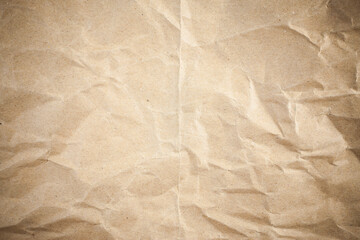 Vignette brown crumpled paper.
