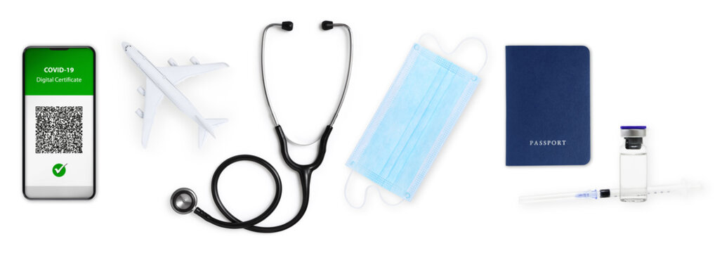 Green pass covid-19 vaccination concept. Passport, face mask, stethoscope, airplane, syringe and vial isolated on white background. Vaccine certificate on smartphone screen with qr code.