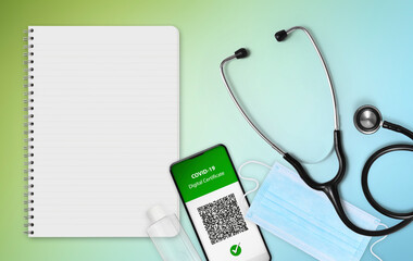 Green pass covid-19 vaccination concept, face mask, stethoscope and digital certificate of vaccine on smartphone screen with qr code, isolated on green and blue background with blank white paper sheet