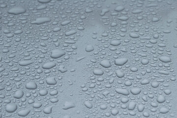 Water drops on grey defocused background