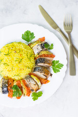 Baked mackerel with vegetables. Ready-made seafood dish.