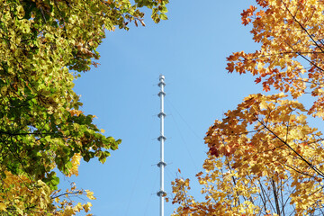 Obninsk meteorological mast in autumn against the blue sky. Obninsk, Russia
