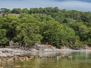 Northern Harbour of ancient city Phaselis. Ruins of Greek city on coast of ancient Lycia. Architectural landmark in Turkey.