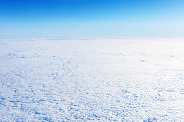 Fototapeta na wymiar Arctic landscape. Snowy winter endless field with blue sky.
