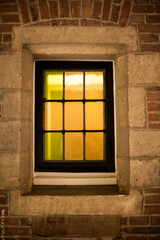 Fototapeta na wymiar window in the old brick wall