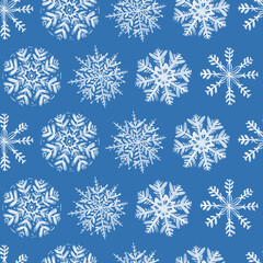 Seamless pattern with silver watercolor snowflakes on blue background. Hand painted winter illustration.