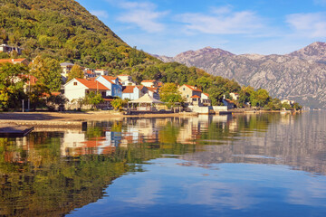 Fototapeta na wymiar Beautiful Mediterranean landscape on sunny autumn day. Montenegro, Adriatic Sea. View of Bay of Kotor and Stoliv village