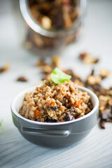 boiled buckwheat with vegetables and dried forest mushrooms in a ceramic mold