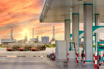 Gas station with fuel truck on highway for transport fuel to petrochemical oil refinery in sunrise