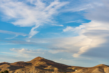 clouds over the mountains in Mojave California
 - obrazy, fototapety, plakaty