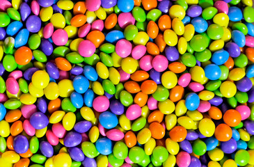 Fototapeta na wymiar Assorted bright colorful Chocolate candys, Sugar Coated Chocolate Gems Candy.