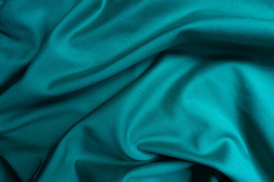 Backdrop - blue green polyester fabric in soft folds