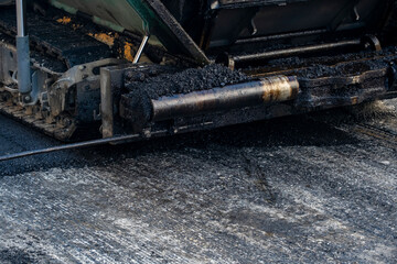 Paving a road with porous asphalt for traffic noise reduction in Geneva, switzerland
