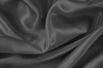 Dark grey fabric texture background, detail of silk or linen pattern.