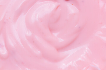 Fototapeta na wymiar Texture pink yogurt,Texture surface of ice cream. Background of strawberry ice cream close-up.