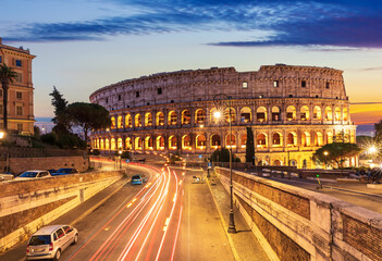 Fototapeta na wymiar Beautiful view on Colosseum and a road nearby at sunset, Rome, Italy