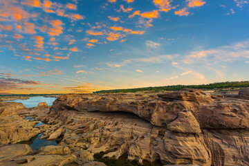 grand canyon,Ubon Ratchathani,Scenery of Eroded large rocky rapids gorge with Mekong river and colorful sky in the sunset