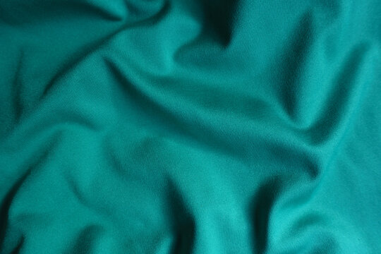 Simple blue green polyester fabric in soft folds
